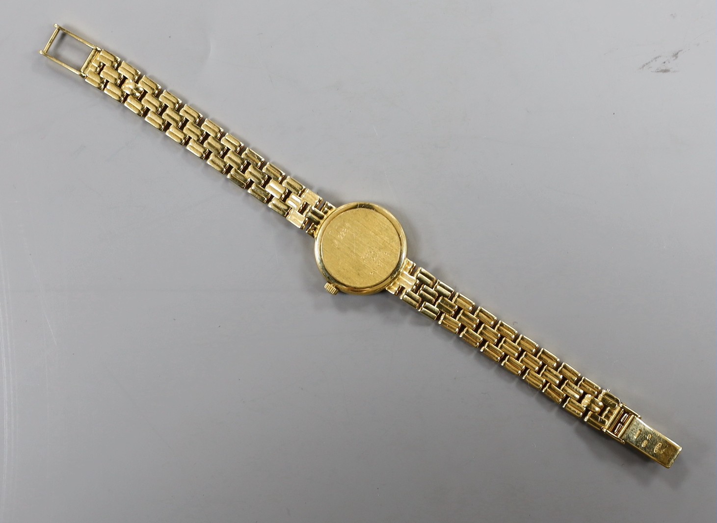 A lady's 18ct gold Longines quartz wrist watch, with mother of pearl dial and diamond chip set bezel, on an 18ct gold Longines bracelet, approx. 16cm, gross weight 33.2 grams, no box or papers.